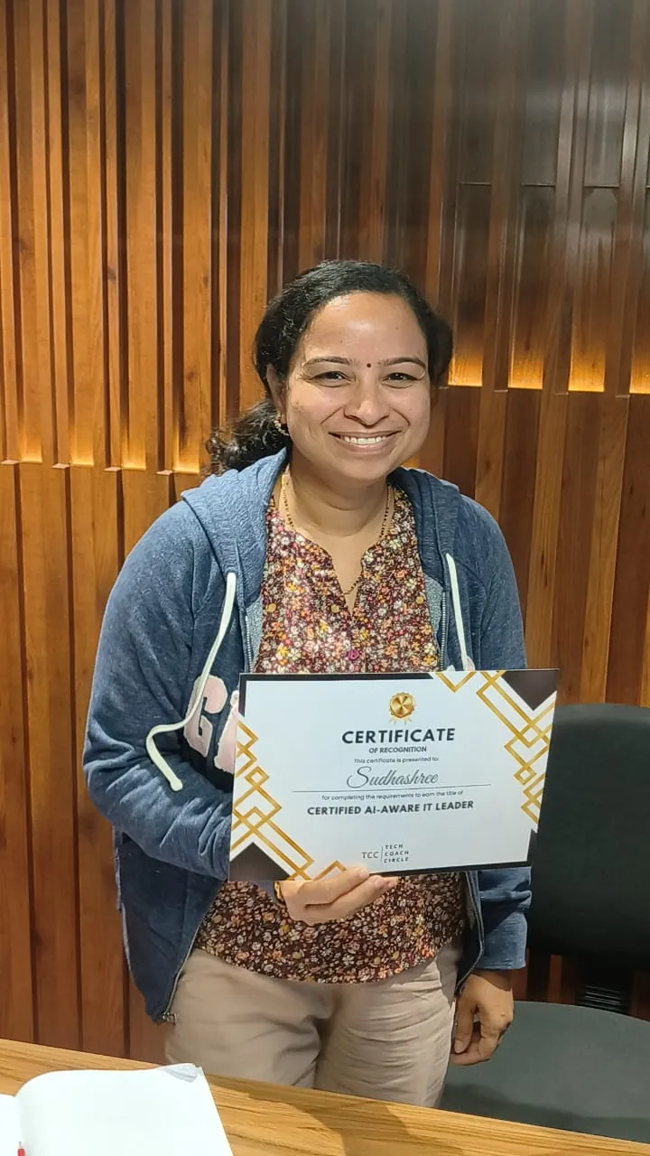 A graduate of the AI-Aware IT Leader programme with her certificate