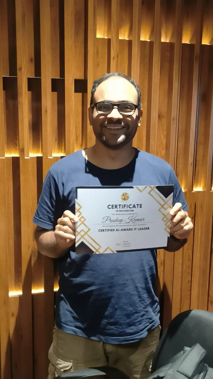 A graduate of the AI-Aware IT Leader programme with his certificate
